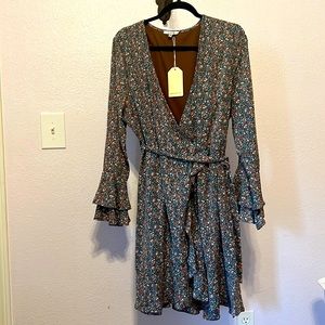 New size large Jodifl dress. Wrap above knee style with brown, blue and cream